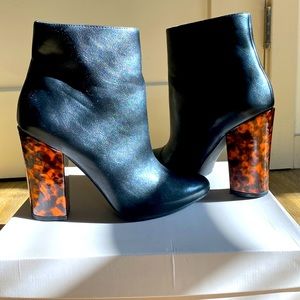 Black leather bootie with tortoise shell heel.